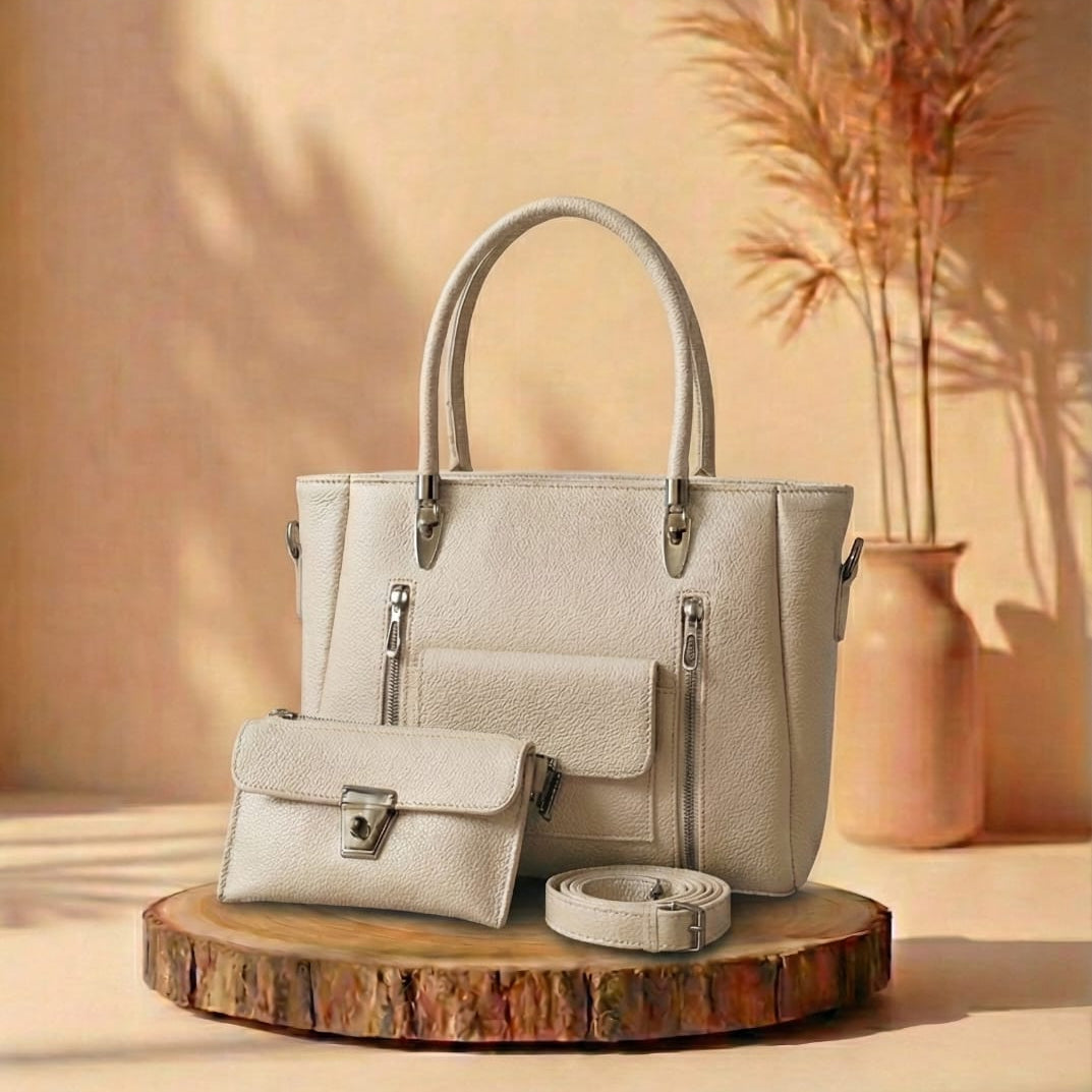 white handbag with matching pouch on a wooden stand against a beige background