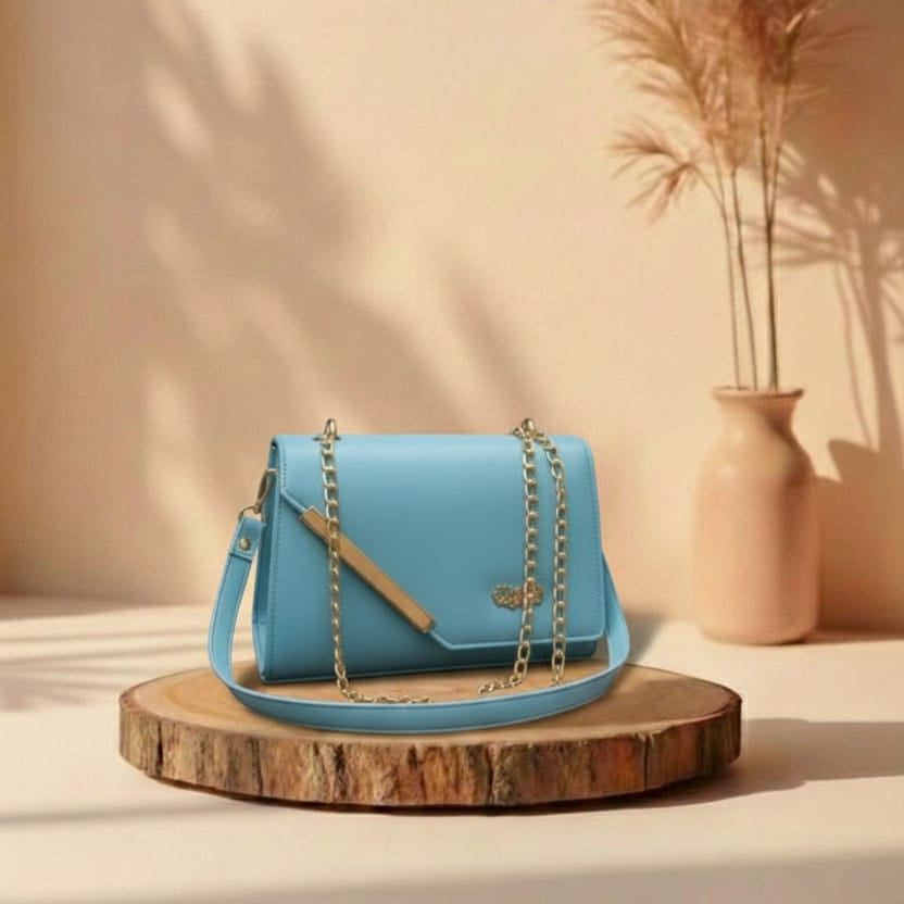 light Blue handbag on a wooden stand with a beige wall and vase in the background