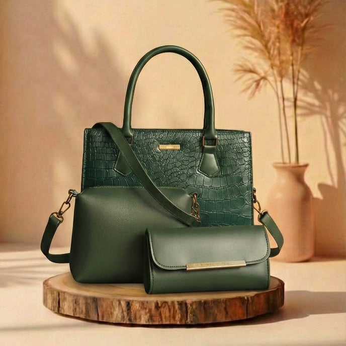 Green handbag with matching pouch on a wooden stand against a beige background