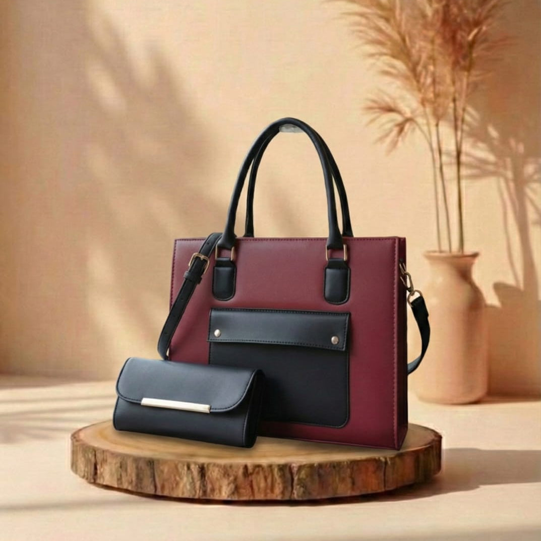 Two handbags, one red and one black, on a wooden stand with a beige background.